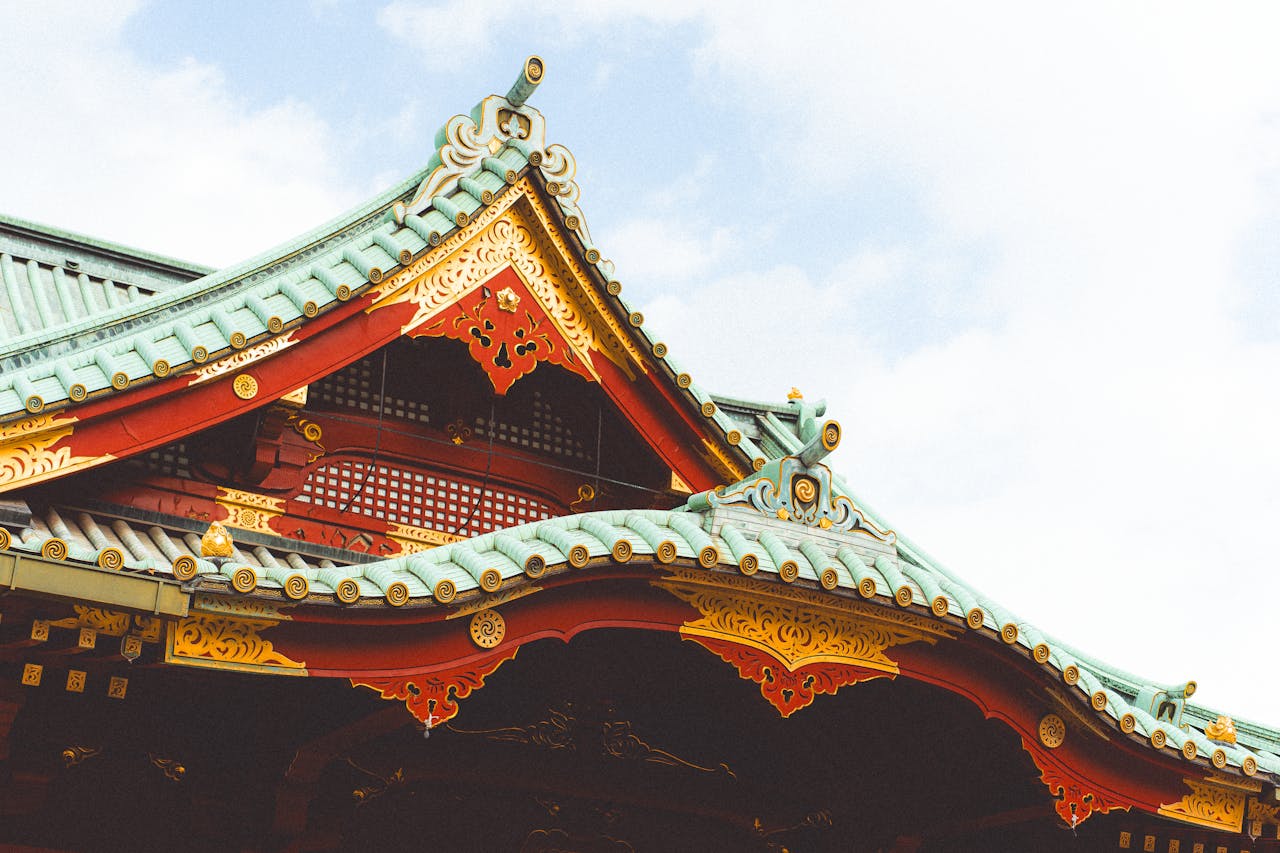 Intricate Japanese temple roof architecture in Tokyo, showcasing classic designs.