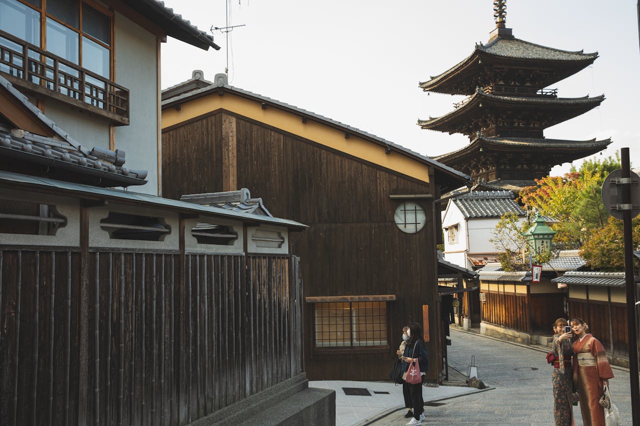 Charming Kyoto street scene featuring the iconic Yasaka Pagoda and traditional wooden houses.