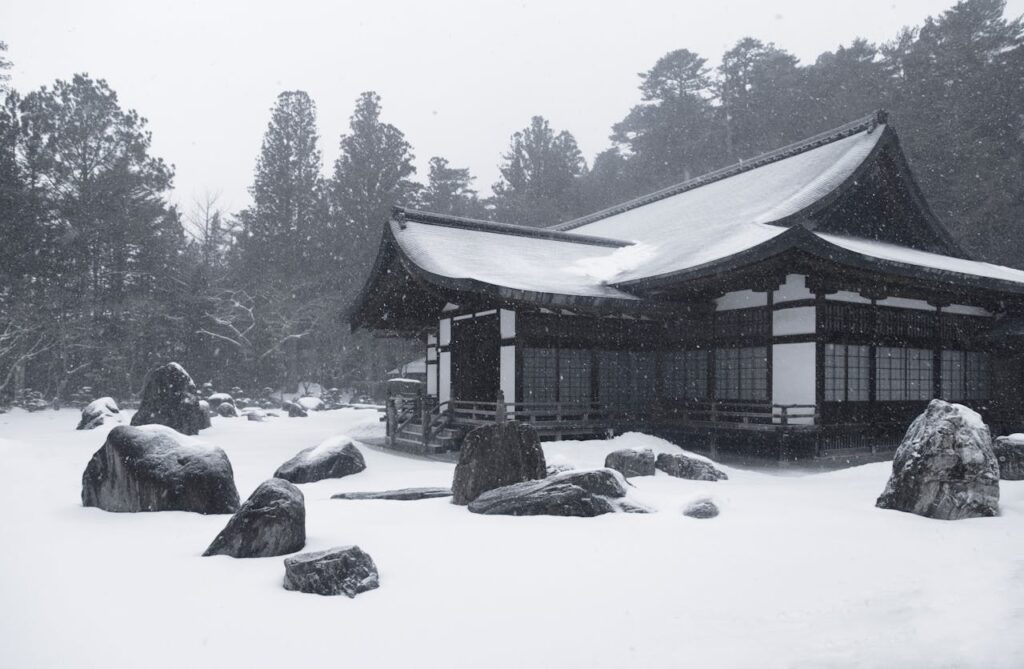 Japanese house amidst snowfall in Nagawa, Nagano, Japan, creating a serene winter scene.