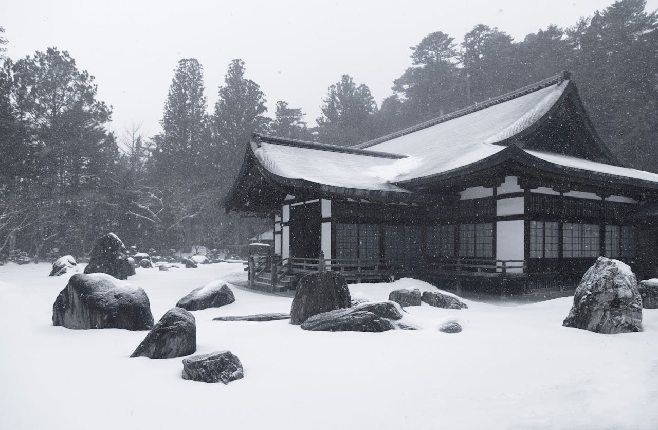 Japanese house amidst snowfall in Nagawa, Nagano, Japan, creating a serene winter scene.