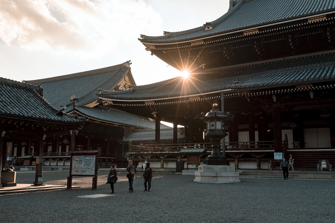 Beautiful Kyoto temple architecture illuminated by sunset, capturing traditional Japanese design.